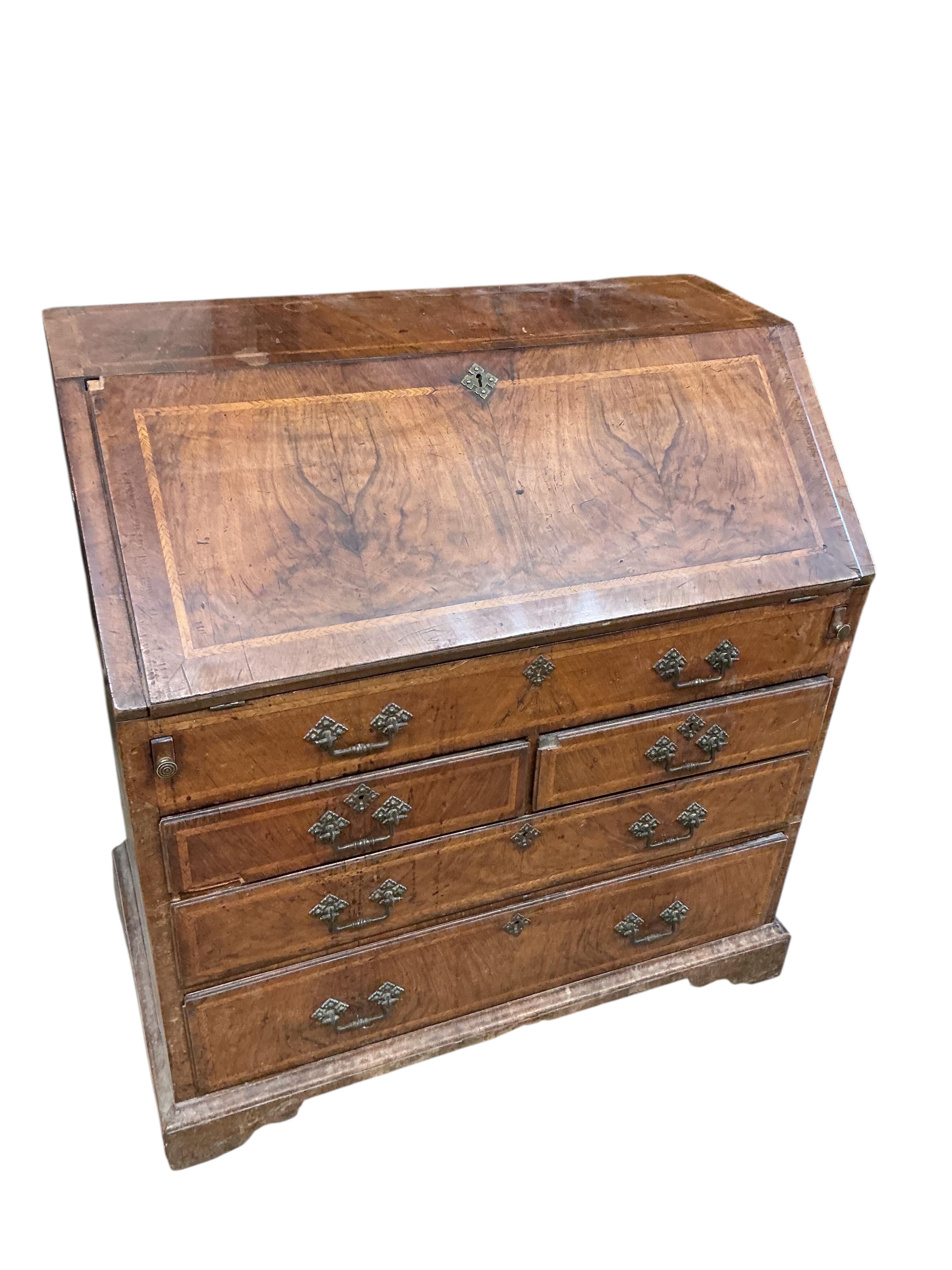 A mid 18th century feather banded walnut bureau, width 91cm, depth 52cm, height 97cm
